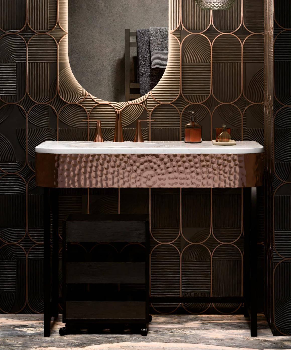 Lighted arch mirror over a hammered copper vanity against fluted bronze wall panels